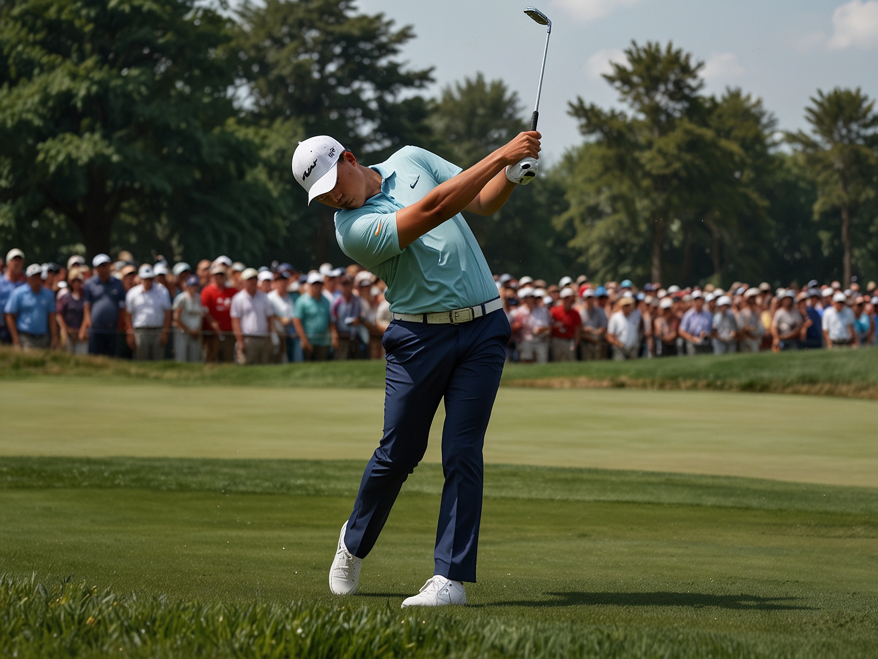 Tom Kim tees off during the final round at the Travelers Championship, showcasing his precision and focused gameplay as he maintains his one-shot lead.