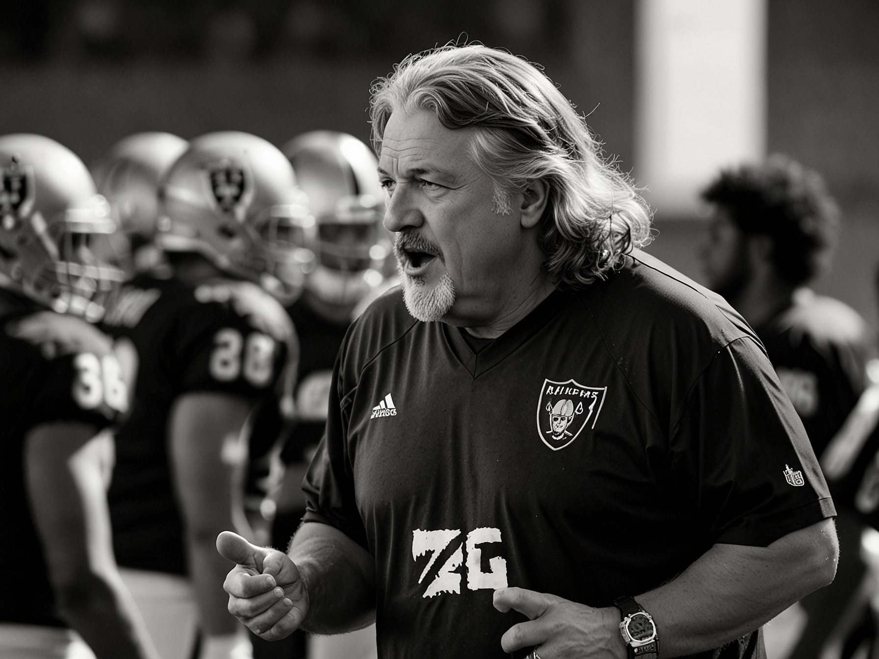 Rob Ryan passionately discussing strategy with the Raiders' 4th-year safety during a practice session, emphasizing his role as a mentor and recognizing the player's talent and potential.