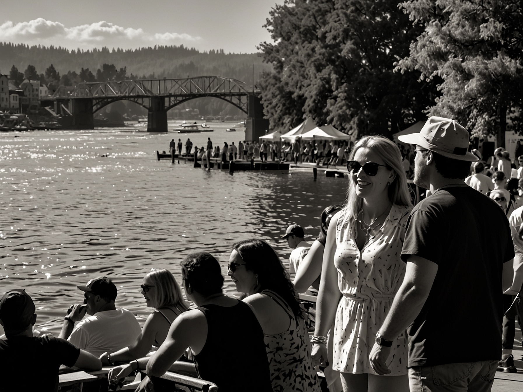 Music lovers enjoy a sunny day at the Waterfront Blues Festival. Multiple stages host live performances by blues artists against the picturesque backdrop of the Willamette River.