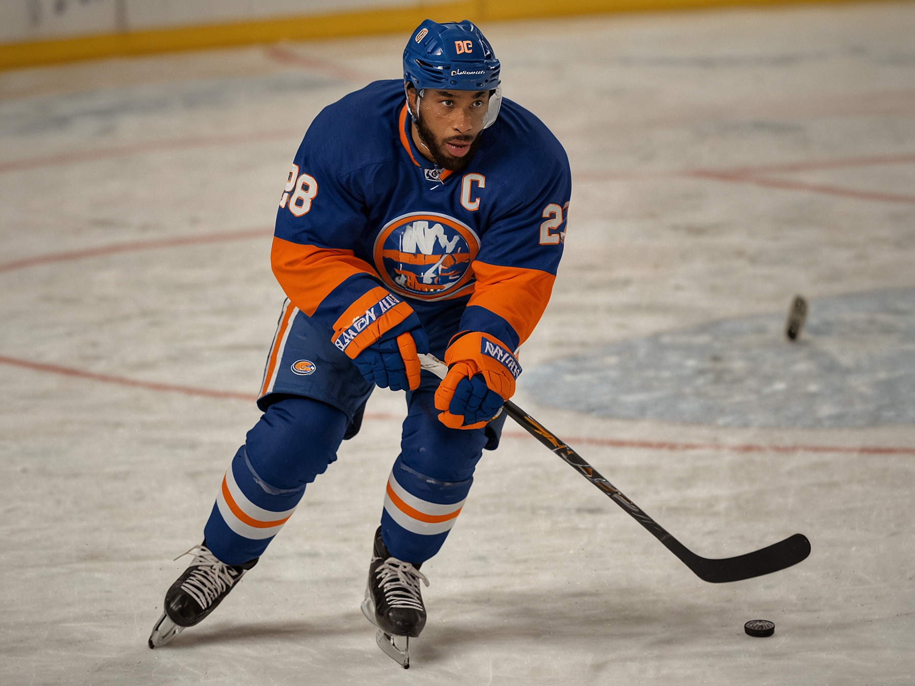 Anthony Duclair, in his New York Islanders jersey, skating swiftly during a game. This image captures Duclair's speed and agility, highlighting his role in bolstering the Islanders' offensive lineup.